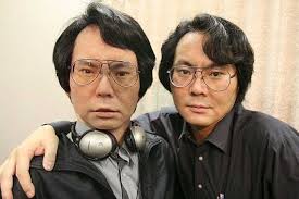 Photo of Hiroshi Ishiguro and robot